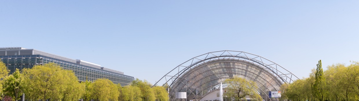 The glass hall of the Leipzig Trade Fair. The trade fair lake in the foreground.