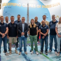 Group photo in front of a banner for the Paralympic Games of Paris 2024 Group photo in front of a banner for the Paralympic Games of Paris 2024
