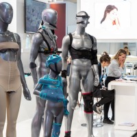 Exhibition booth at OTWorld featuring futuristic mannequins displaying orthopedic and medical assistive devices. Exhibition booth at OTWorld featuring futuristic mannequins displaying orthopedic and medical assistive devices.