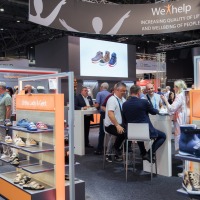 Conversation situation at an exhibition stand for orthopaedic shoes. Conversation situation at an exhibition stand for orthopaedic shoes.